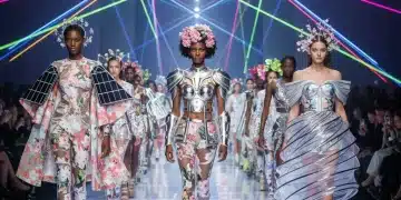 Models on a runway presenting innovative Spring 2026 high fashion designs with bold colors and unique shapes.